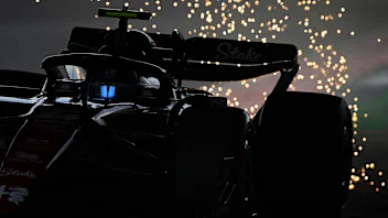 SUZUKA, JAPAN - SEPTEMBER 23: Sparks fly behind Zhou Guanyu of China driving the (24) Alfa Romeo F1