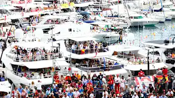 MONTE-CARLO, MONACO - MAY 28: Spectators watch on from yachts in the harbor during the F1 Grand