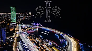 JEDDAH, SAUDI ARABIA - MARCH 19: A drone light display showing racing drivers is seen over the grid