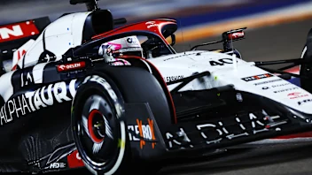 SINGAPORE, SINGAPORE - SEPTEMBER 17: Liam Lawson of New Zealand driving the (40) Scuderia