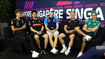 SINGAPORE, SINGAPORE - SEPTEMBER 14: George Russell of Great Britain and Mercedes, Zhou Guanyu of