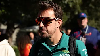 MELBOURNE, AUSTRALIA - MARCH 22: Fernando Alonso of Spain and Aston Martin F1 Team walks in the