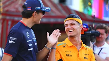 BAHRAIN, BAHRAIN - FEBRUARY 28: Carlos Sainz of Spain and Ferrari and Lewis Hamilton of Great
