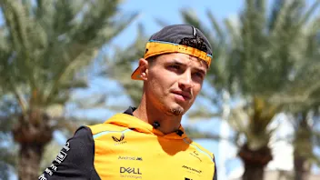 BAHRAIN, BAHRAIN - MARCH 01: Lando Norris of Great Britain and McLaren walks in the Paddock prior