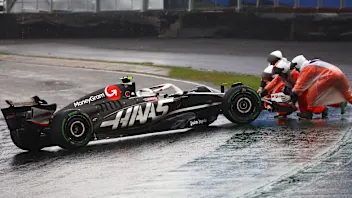 SAO PAULO, BRAZIL - NOVEMBER 03: Marshals push Nico Hulkenberg of Germany driving the (27) Haas F1