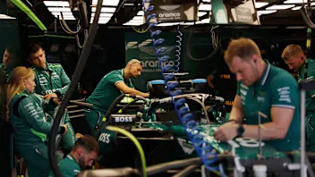 BUDAPEST, HUNGARY - JULY 20: The Aston Martin F1 team work on the car of Lance Stroll of Canada and