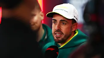 MEXICO CITY, MEXICO - OCTOBER 25: Fernando Alonso of Spain and Aston Martin F1 Team talks to the