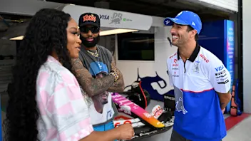 MIAMI, FLORIDA - MAY 05: Odell Beckham Jr and Keke Palmer talks with Daniel Ricciardo of Australia