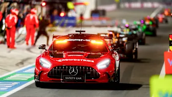 LUSAIL CITY, QATAR - DECEMBER 01: The safety car leads the field through the pits during the F1