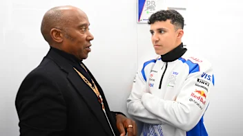 MELBOURNE, AUSTRALIA - MARCH 16: Anthony Hamilton with Isack Hadjar of France and Visa Cash App