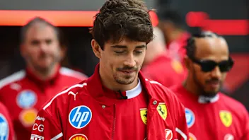 Lewis Hamilton and Charles Leclerc attend the street parade during the Scuderia Ferrari HP Drivers'