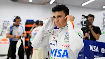 SINGAPORE, SINGAPORE - OCTOBER 03: Isack Hadjar of France and Visa Cash App Racing Bulls prepares