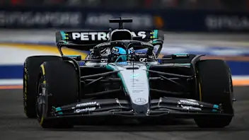 SINGAPORE, SINGAPORE - OCTOBER 03: George Russell of Great Britain driving the (63) Mercedes AMG