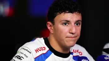 SINGAPORE, SINGAPORE - OCTOBER 04: Eighth placed qualifier Isack Hadjar of France and Visa Cash App