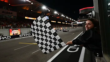 ABU DHABI, UNITED ARAB EMIRATES - DECEMBER 07: Ana de Armas waves the chequered flag during the F1