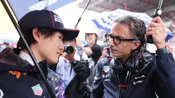 SPA, BELGIUM - JULY 27: Yuki Tsunoda of Japan and Oracle Red Bull Racing talks with Laurent Mekies,