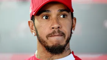 BUDAPEST, HUNGARY - JULY 31: Lewis Hamilton of Great Britain and Scuderia Ferrari talks to the