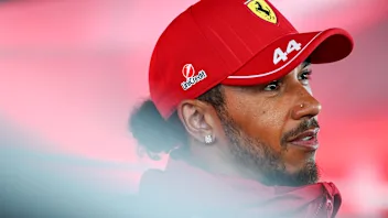 ZANDVOORT, NETHERLANDS - AUGUST 28: Lewis Hamilton of Great Britain and Scuderia Ferrari talks to