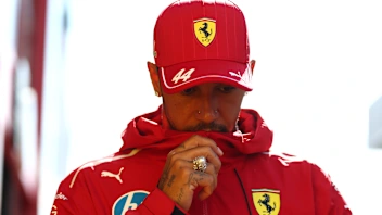 ZANDVOORT, NETHERLANDS - AUGUST 28: Lewis Hamilton of Great Britain and Scuderia Ferrari walks in