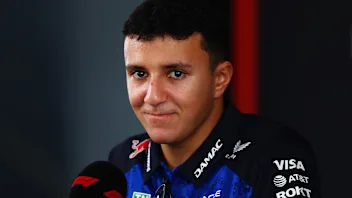 KUALA LUMPUR, MALAYSIA - OCTOBER 01: Isack Hadjar of France and Oracle Red Bull Racing talks to the