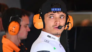 NORTHAMPTON, ENGLAND - JULY 05: Lando Norris of Great Britain and McLaren looks on in the garage