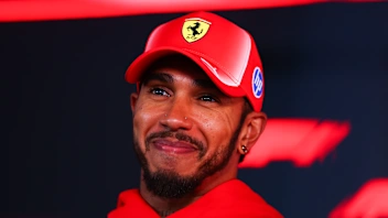 BUDAPEST, HUNGARY - JULY 23: Lewis Hamilton of Great Britain and Scuderia Ferrari talks to the
