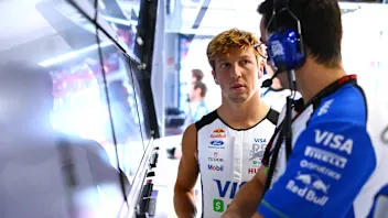 BUDAPEST, HUNGARY - JULY 25: Liam Lawson of New Zealand and Visa Cash App Racing Bulls talks with