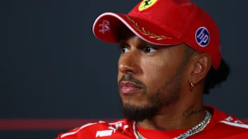 MONZA, ITALY - SEPTEMBER 03: Lewis Hamilton of Great Britain and Scuderia Ferrari looks on in the