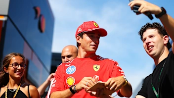 MONZA, ITALY - SEPTEMBER 03: Charles Leclerc of Monaco and Scuderia Ferrari signs autographs for
