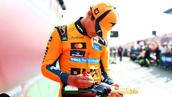 ZANDVOORT, NETHERLANDS - AUGUST 23: Race winner Lando Norris of Great Britain and McLaren signs a
