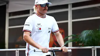 AUSTIN, TEXAS - OCTOBER 22: Valtteri Bottas of Finland and Cadillac F1 Team rides his scooter in