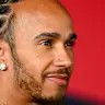 MEXICO CITY, MEXICO - OCTOBER 29: Lewis Hamilton of Great Britain and Scuderia Ferrari talks to the
