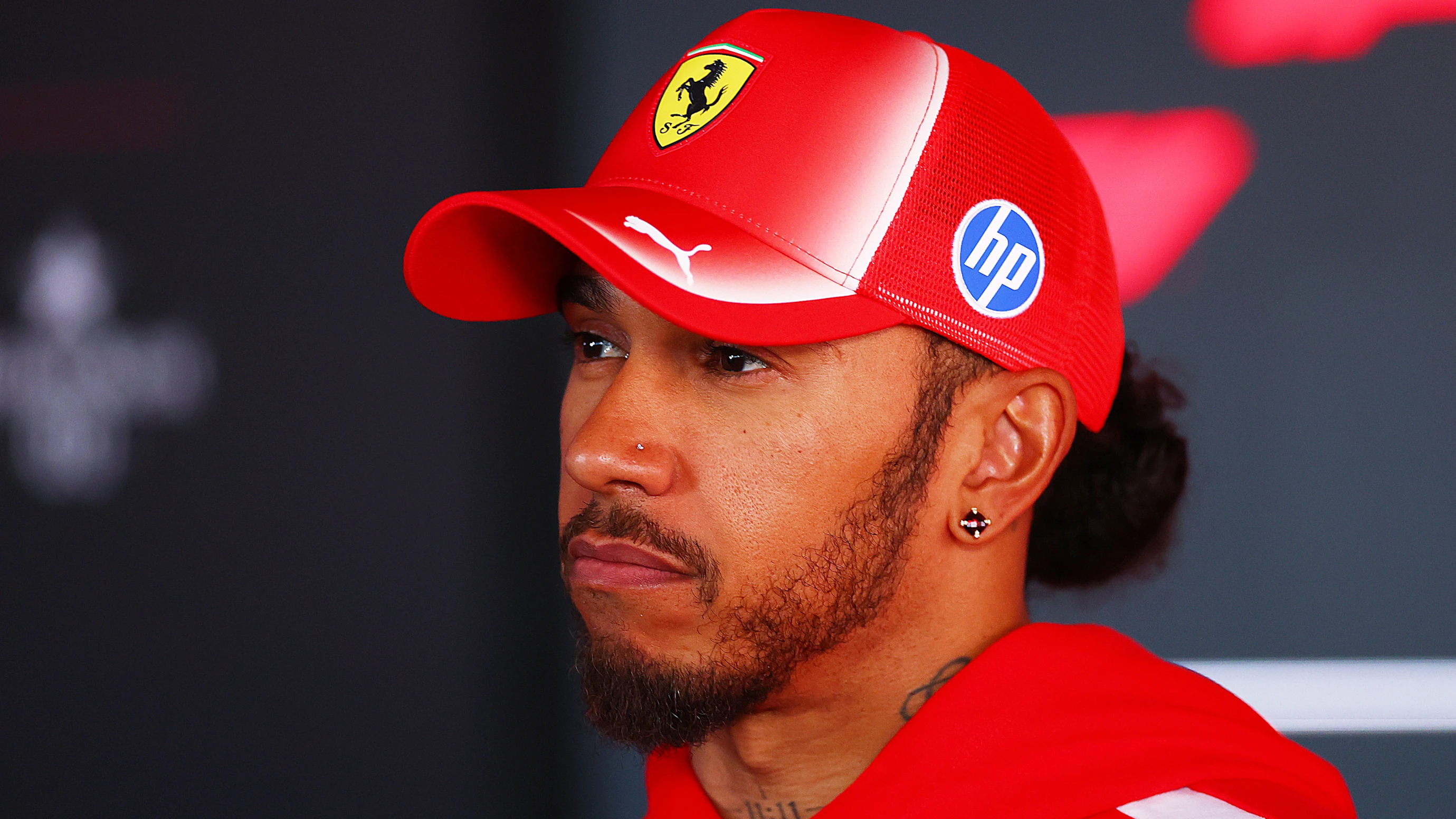BUDAPEST, HUNGARY - JULY 23: Lewis Hamilton of Great Britain and Scuderia Ferrari talks to the