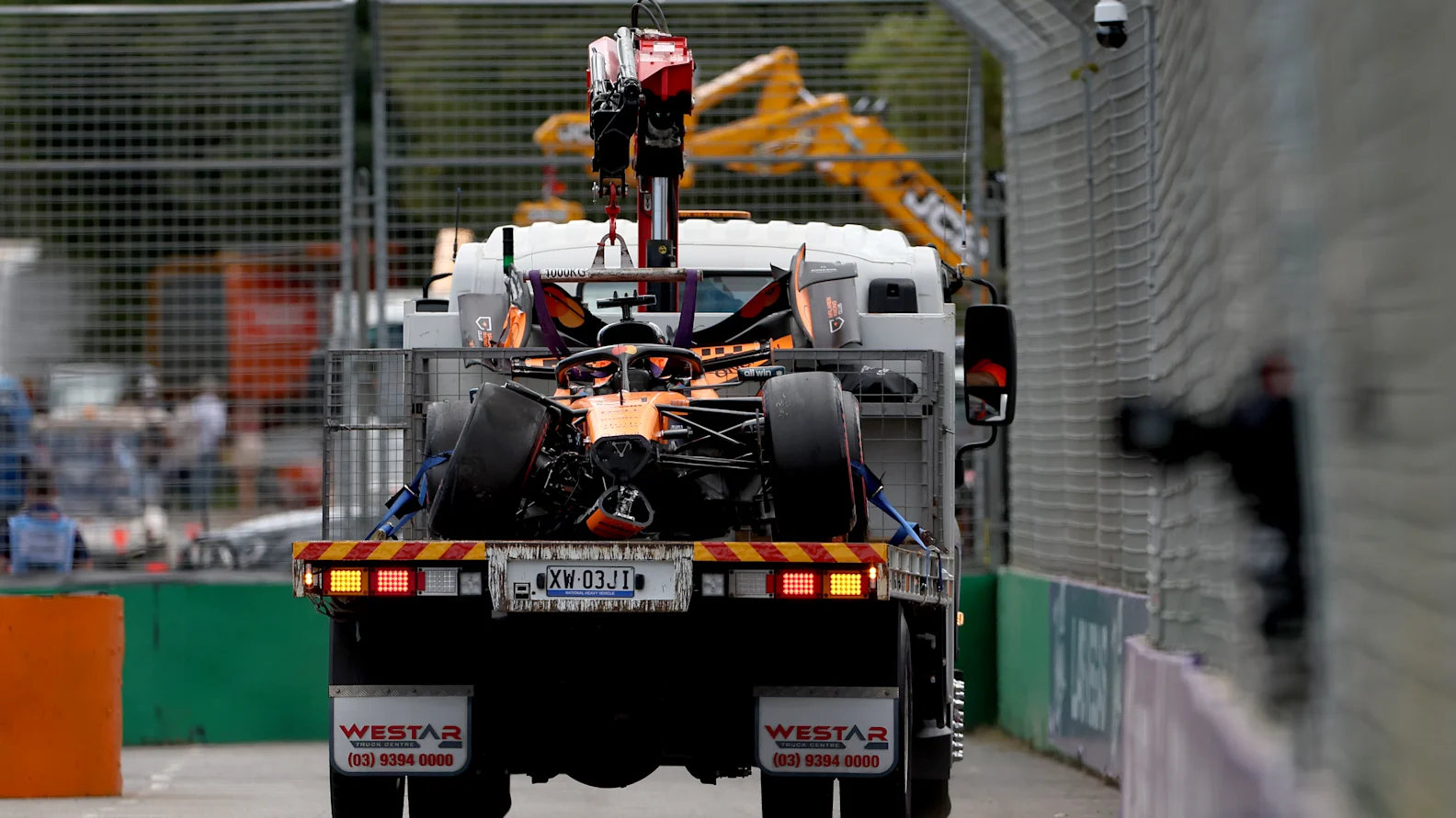 MELBOURNE, AUSTRALIA - MARCH 08: The crashed car of Oscar Piastri of Australia driving the (81) McLaren MCL40 Mercedes is cleared by the marshals during the F1 Grand Prix of Australia at Albert Park Grand Prix Circuit on March 08, 2026 in Melbourne, Australia. (Photo by Dom Gibbons - Formula 1/Formula 1 via Getty Images)