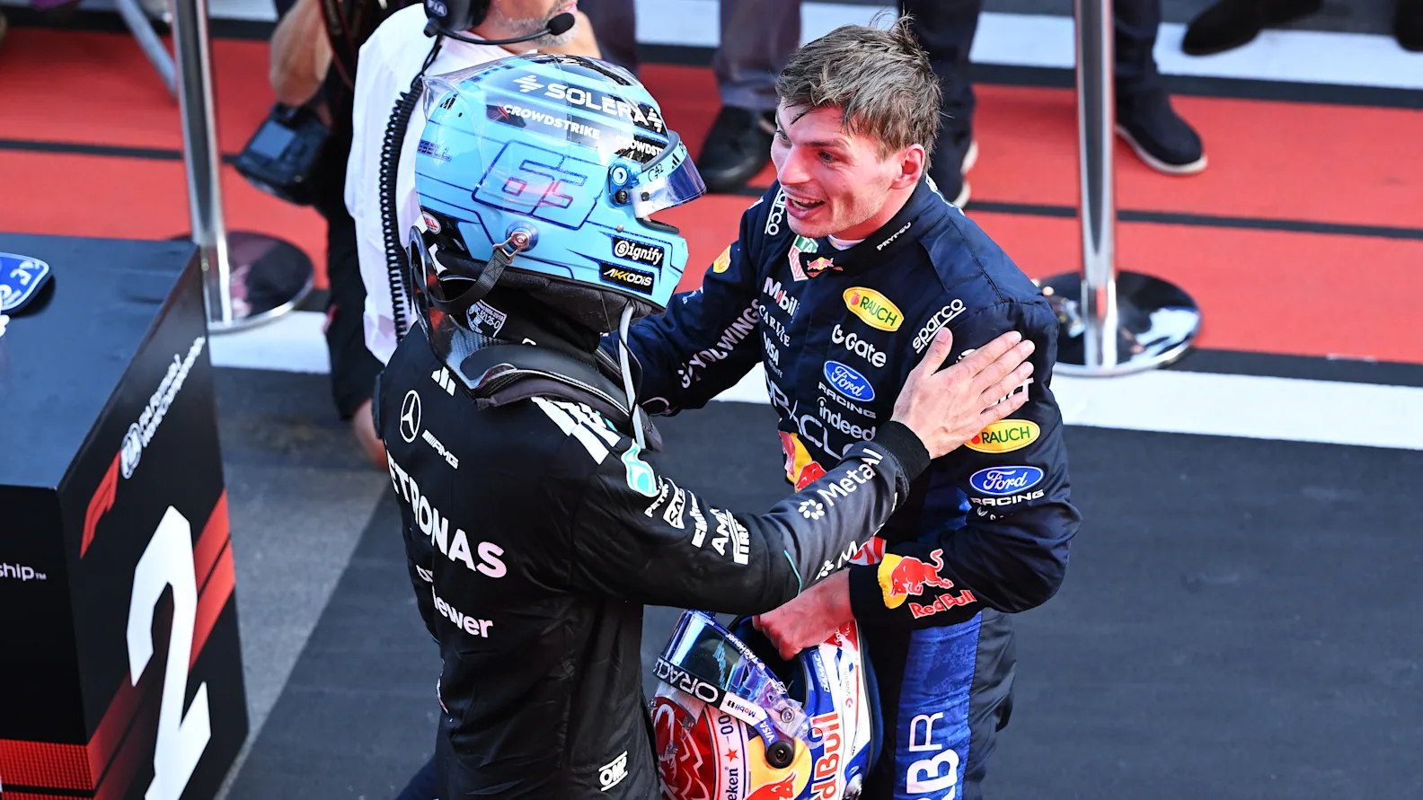 BAKU, AZERBAIJAN - SEPTEMBER 26: Race winner George Russell of Great Britain and Mercedes AMG Petronas F1 Team and Second placed Max Verstappen of the Netherlands and Oracle Red Bull Racing talk in parc ferme during the F1 Grand Prix of Azerbaijan at Baku City Circuit on September 26, 2026 in Baku, Azerbaijan. (Photo by Bryn Lennon - Formula 1/Formula 1 via Getty Images)