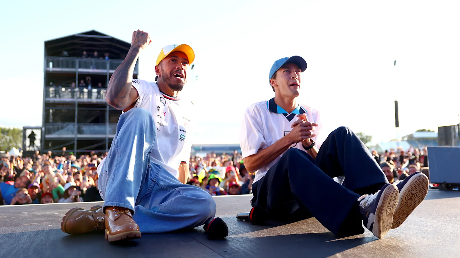 NORTHAMPTON, ENGLAND - JULY 06: Lewis Hamilton of Great Britain and Mercedes and George Russell of
