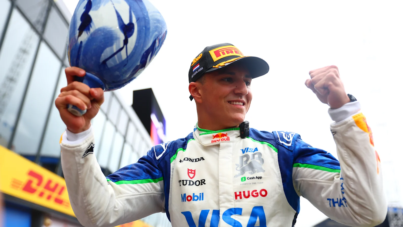 ZANDVOORT, NETHERLANDS - AUGUST 31: Third placed Isack Hadjar of France and Visa Cash App Racing Bulls celebrates with his team during the F1 Grand Prix of Netherlands at Circuit Zandvoort on August 31, 2025 in Zandvoort, Netherlands. (Photo by Joe Portlock/Getty Images)