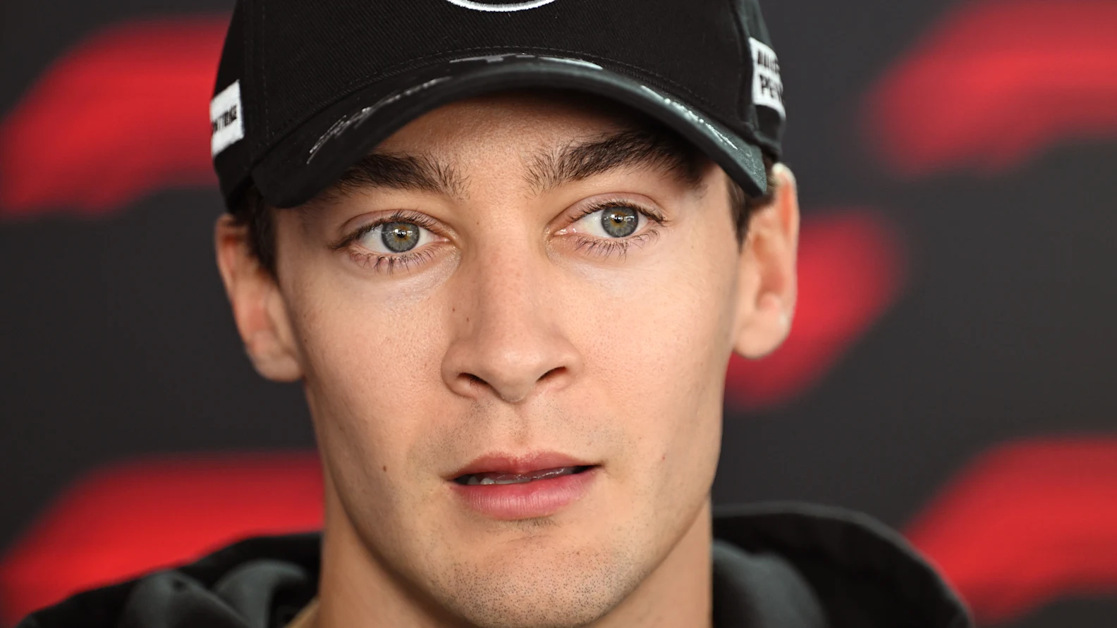 SUZUKA, JAPAN - MARCH 26: George Russell of Great Britain and Mercedes AMG Petronas F1 Team talks