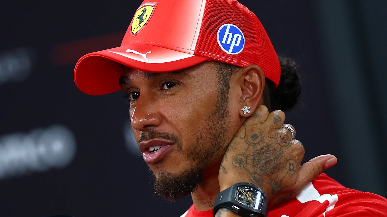 SINGAPORE, SINGAPORE - OCTOBER 08: Lewis Hamilton of Great Britain and Scuderia Ferrari talks to the media during previews ahead of the F1 Grand Prix of Singapore at Marina Bay Street Circuit on October 08, 2026 in Singapore, Singapore. (Photo by Clive Mason/Getty Images)