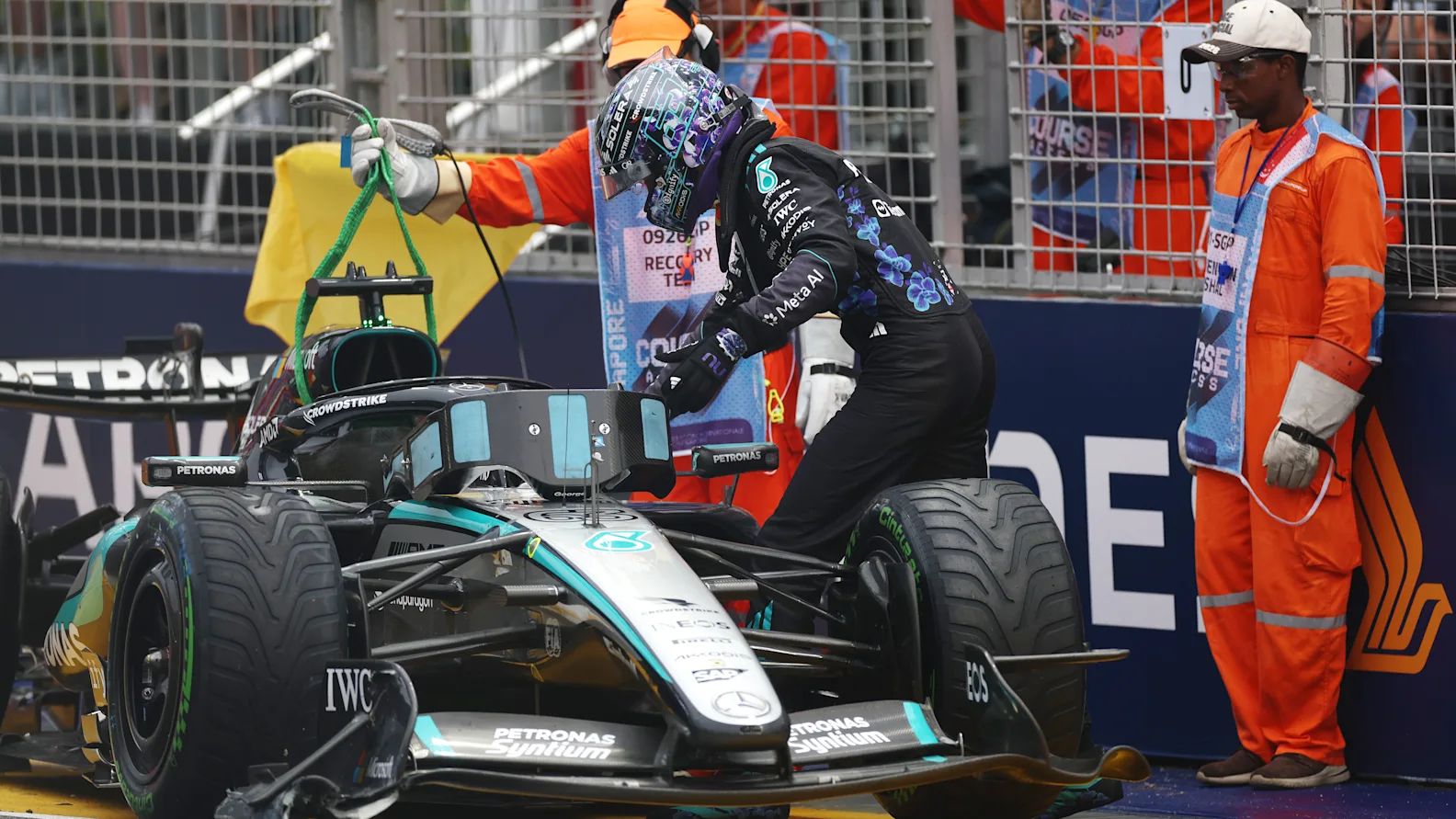 SINGAPORE, SINGAPORE - OCTOBER 10: George Russell of Great Britain and Mercedes AMG Petronas F1 Team walks away from the car after crashing out of the race during the Sprint ahead of the F1 Grand Prix of Singapore at Marina Bay Street Circuit on October 10, 2026 in Singapore, Singapore. (Photo by Peter Fox/Getty Images)