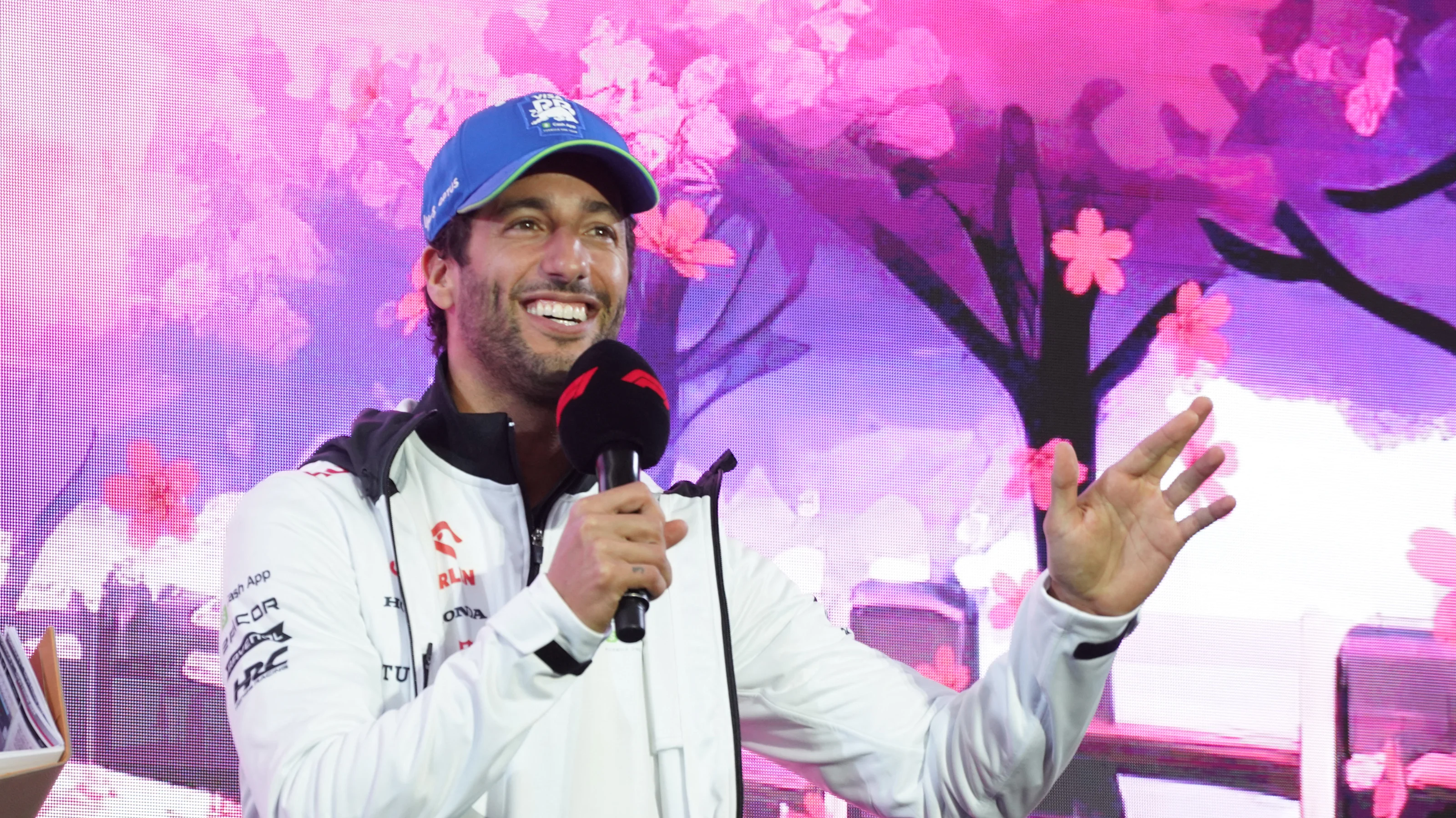 RB's Australian driver Daniel Ricciardo speaks during a talk session as part of the 2024 FIA