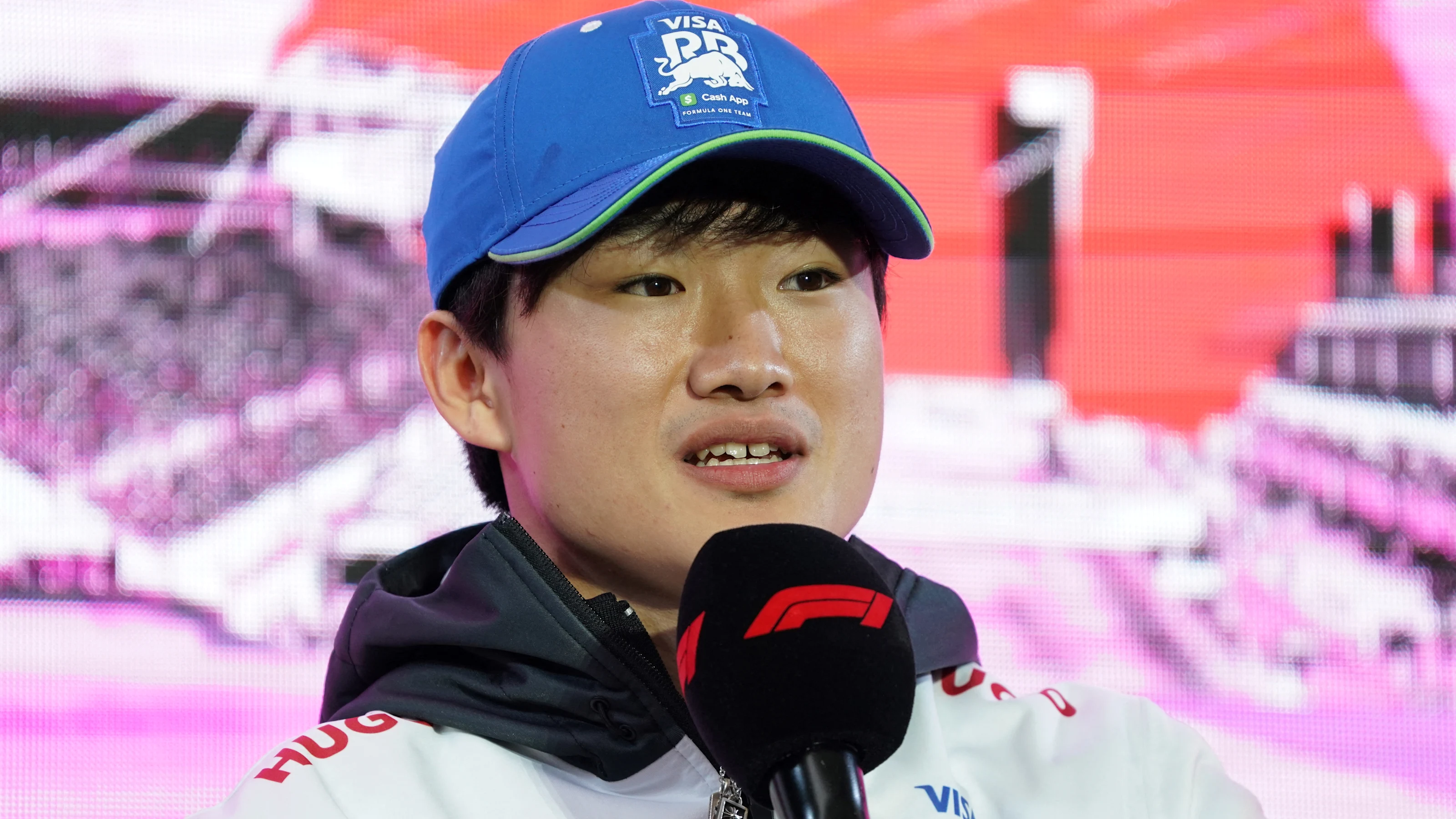 RB's Japanese driver Yuki Tsunoda speaks during a talk session as part of the 2024 FIA Formula One