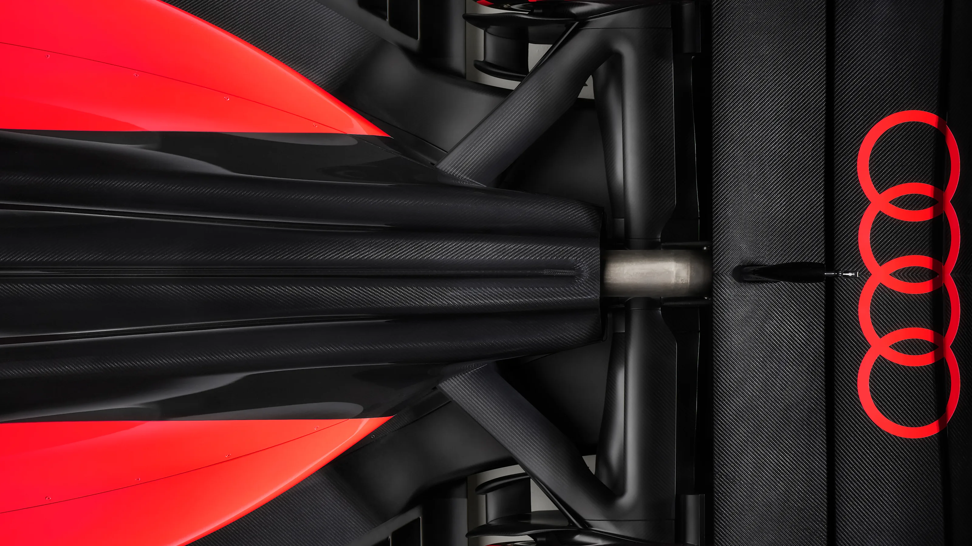 Indoor studio shot, exterior, bird’s-eye view, detail of rear section and rear wing