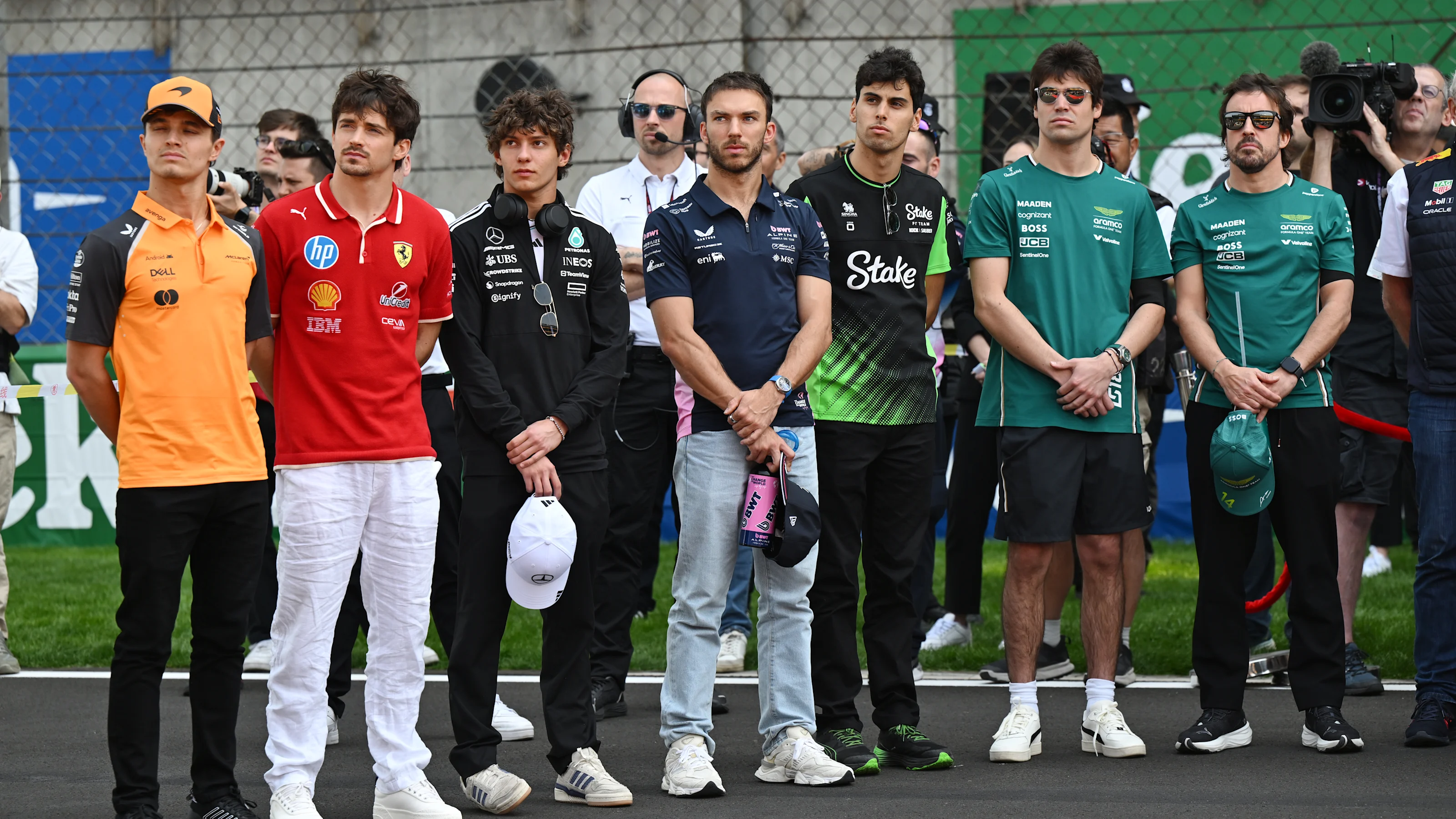 SHANGHAI, CHINA - MARCH 23: Drivers and team personnel gather for a tribute to the late Eddie
