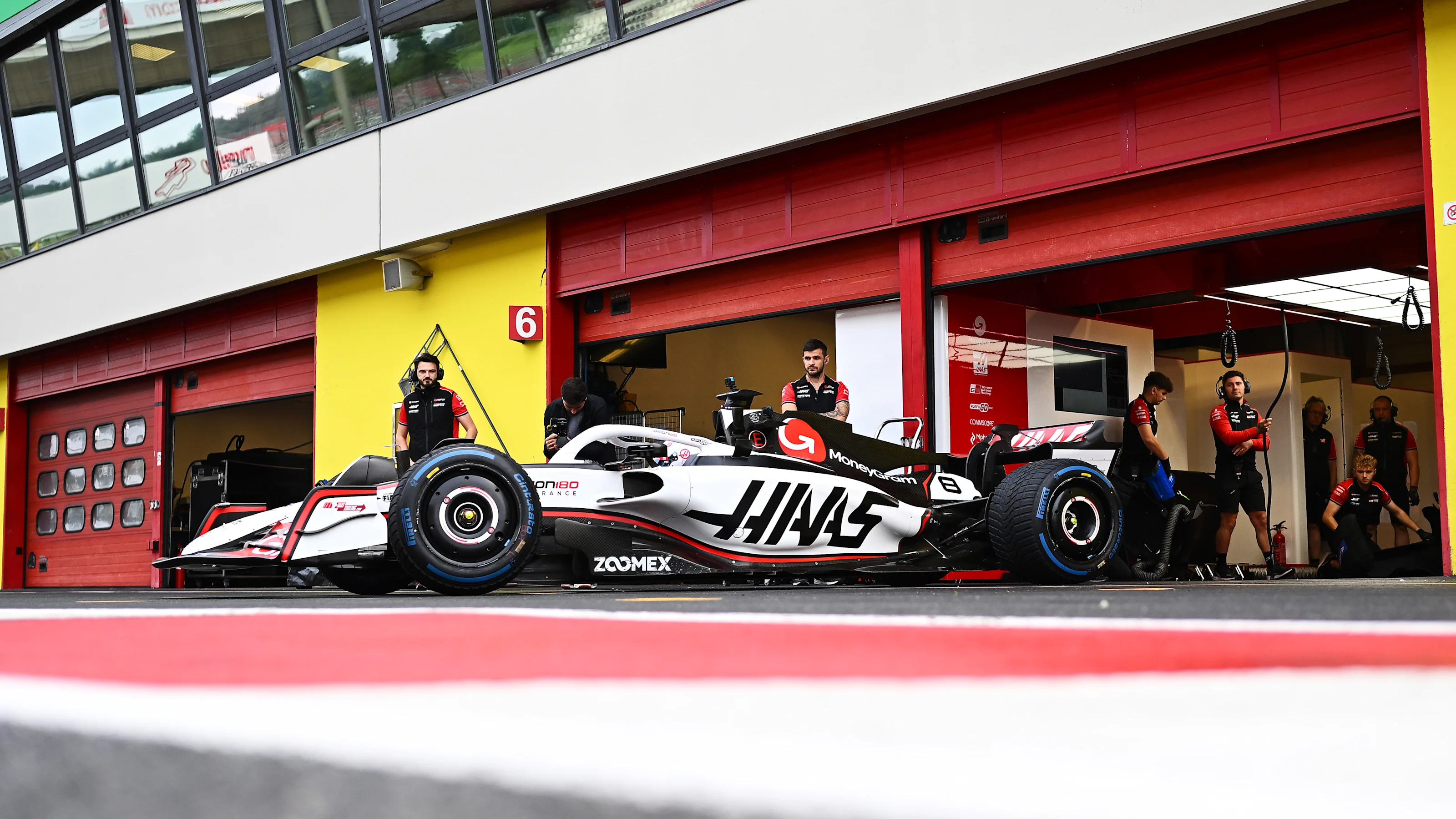 SCARPERIA, ITALY - SEPTEMBER 26: Romain Grosjean of France driving the Haas F1 Ferrari leaves the