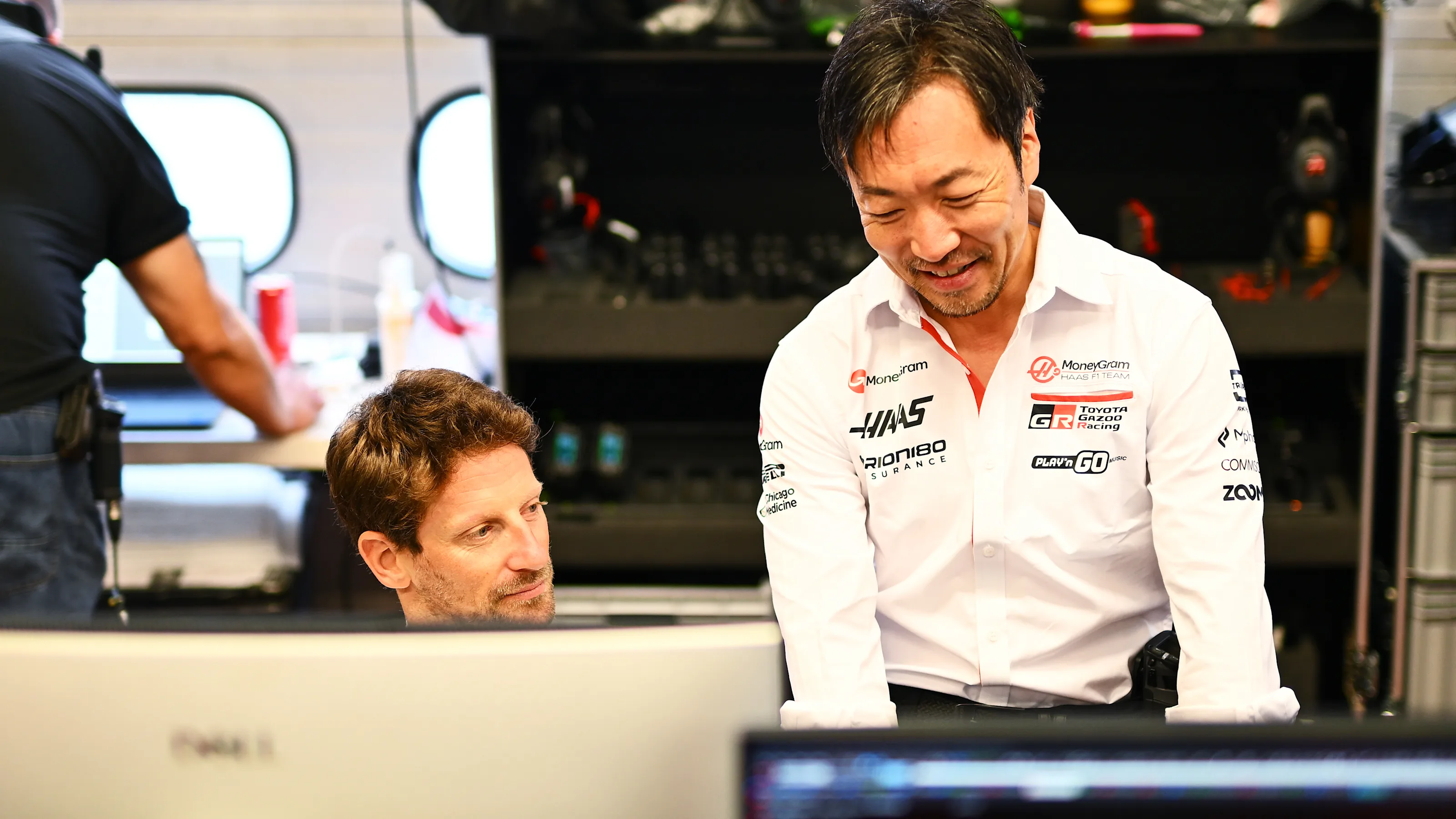 SCARPERIA, ITALY - SEPTEMBER 26: Romain Grosjean of France talks with Ayao Komatsu, Team Principal