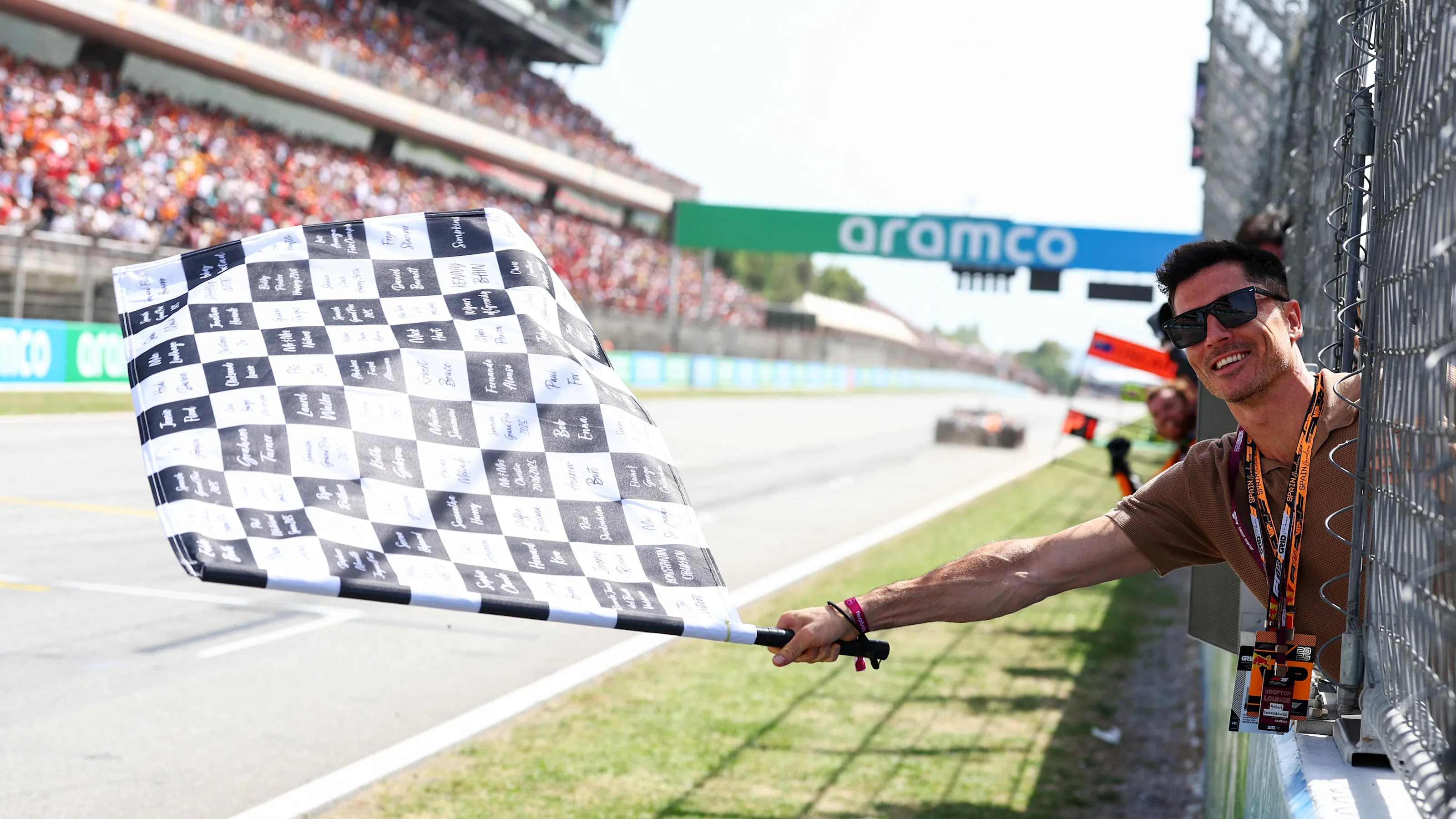 BARCELONA, SPAIN - JUNE 01: Robert Lewandowski waves the chequered flag during the F1 Grand Prix of