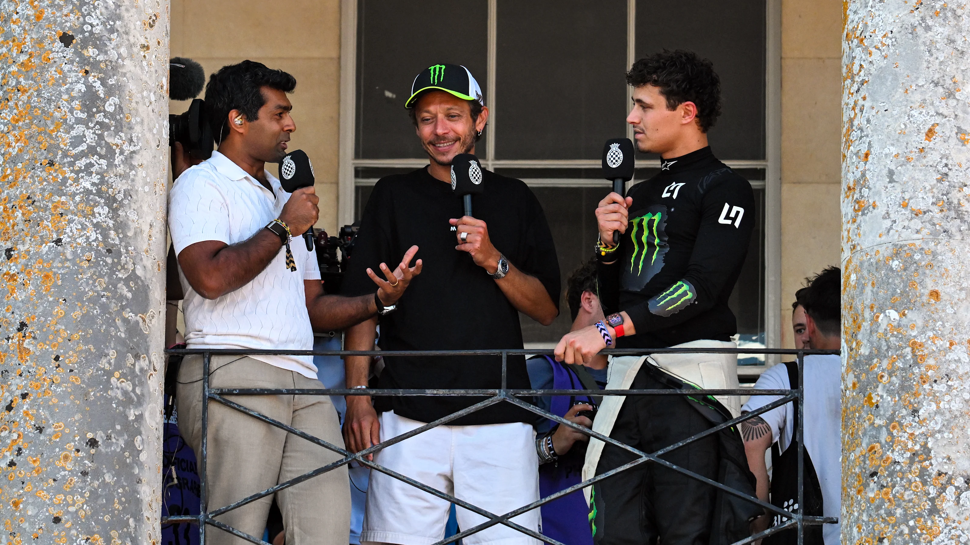 CHICHESTER, ENGLAND - JULY 10: Karun Chandhok talks to Valentino Rossi and Lando Norris on the