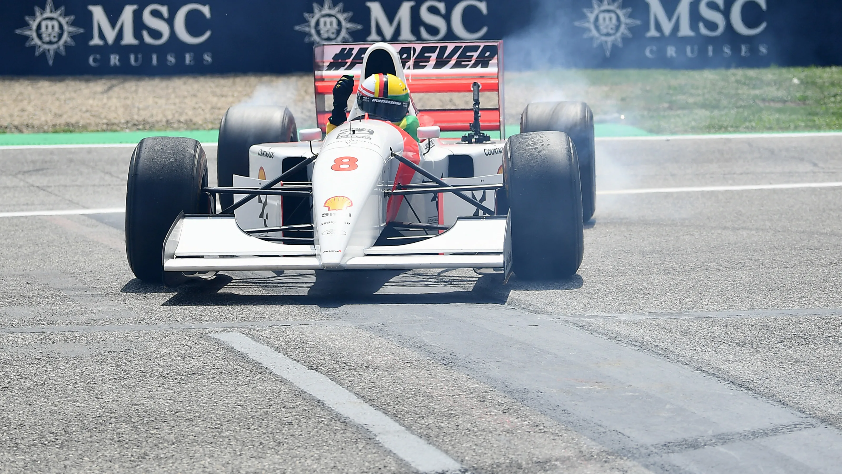 IMOLA, ITALY - MAY 19: Sebastian Vettel performs donuts in the McLaren MP4/8 of Ayrton Senna on