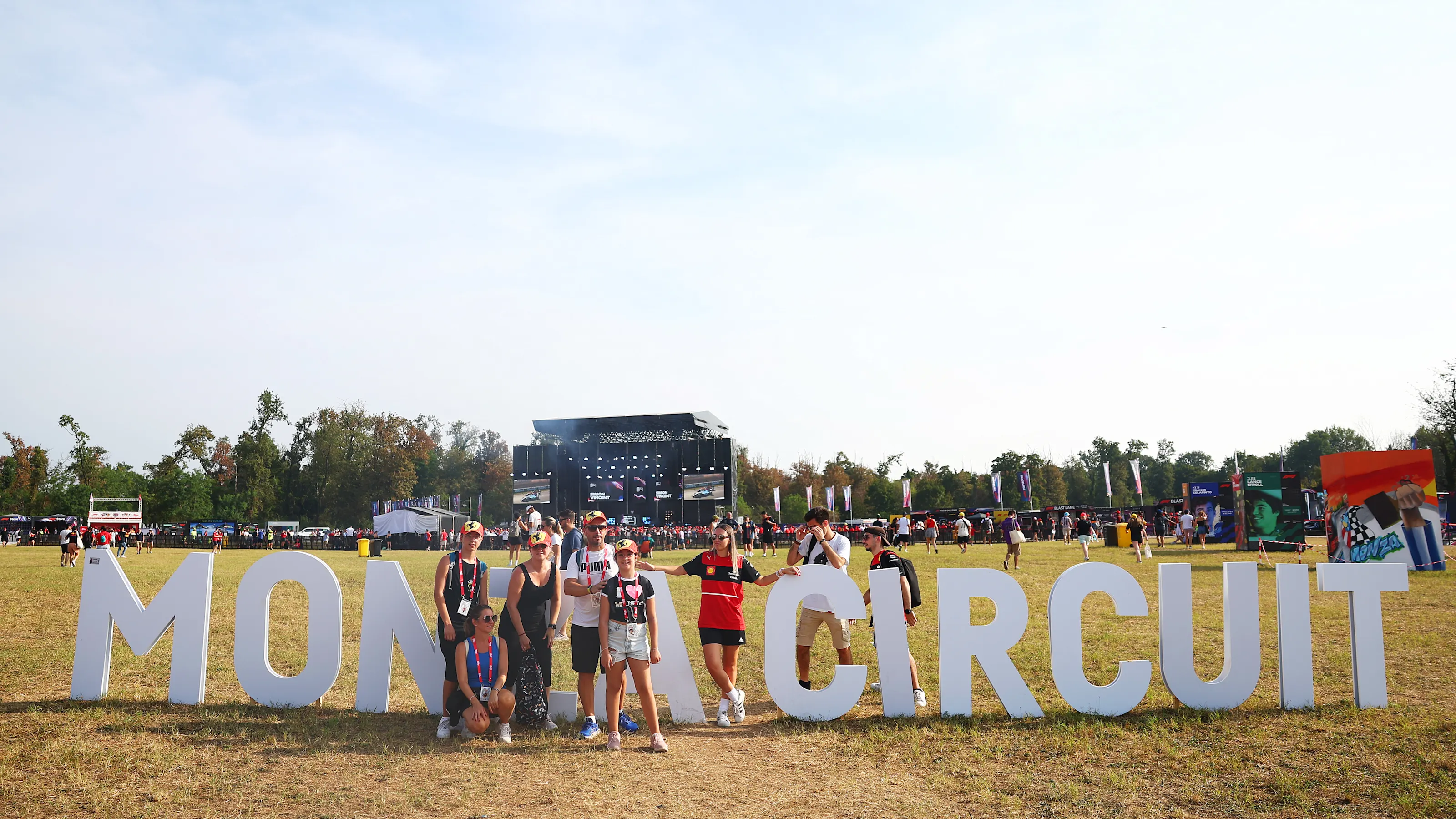 MONZA, ITALY - AUGUST 31: Fans pose for a picture in the fan zone prior to final practice ahead of
